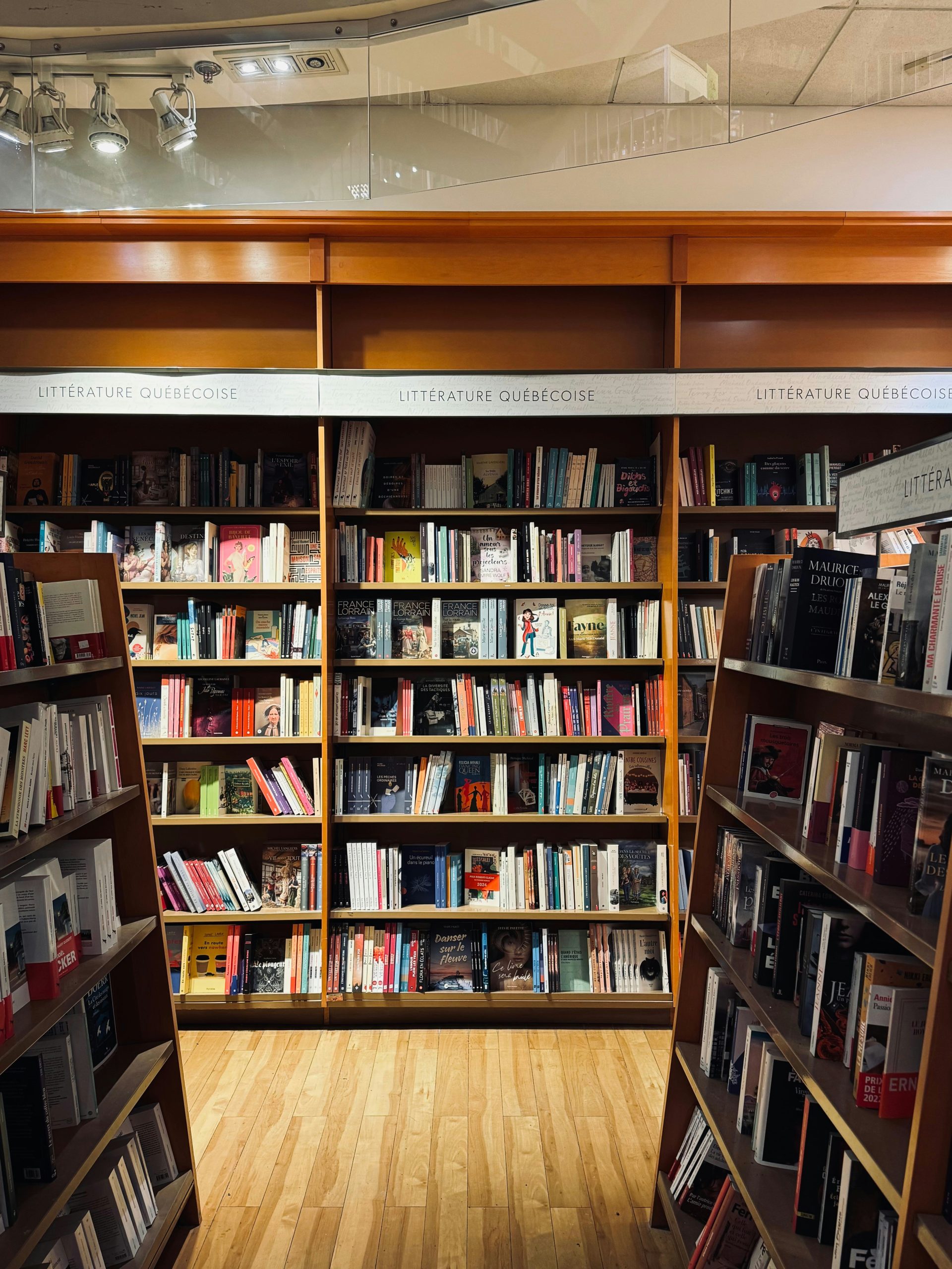 A bookstore's bookshelves are filled with various books.